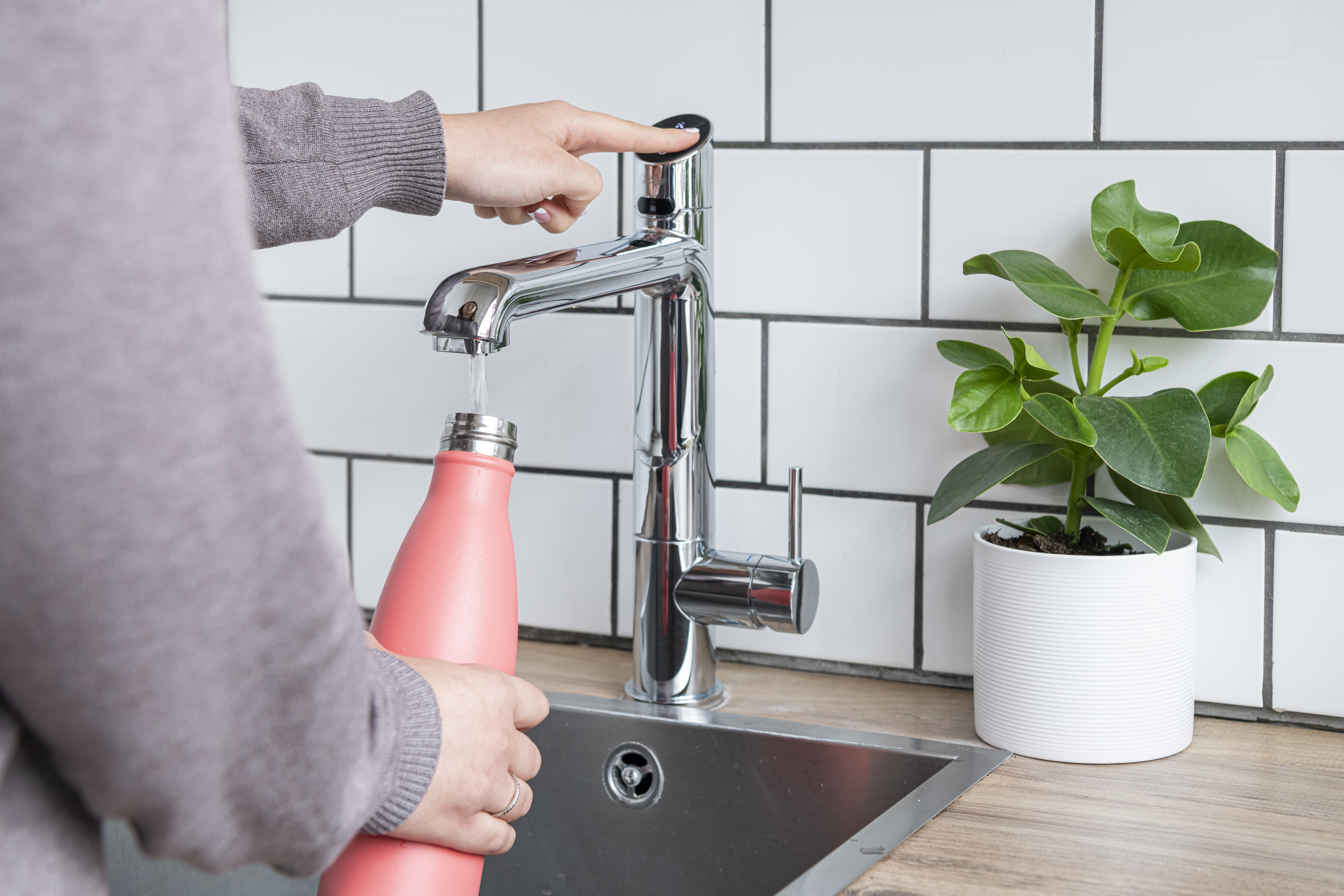 Contemporary workspace design involving a dedicated hydration station.