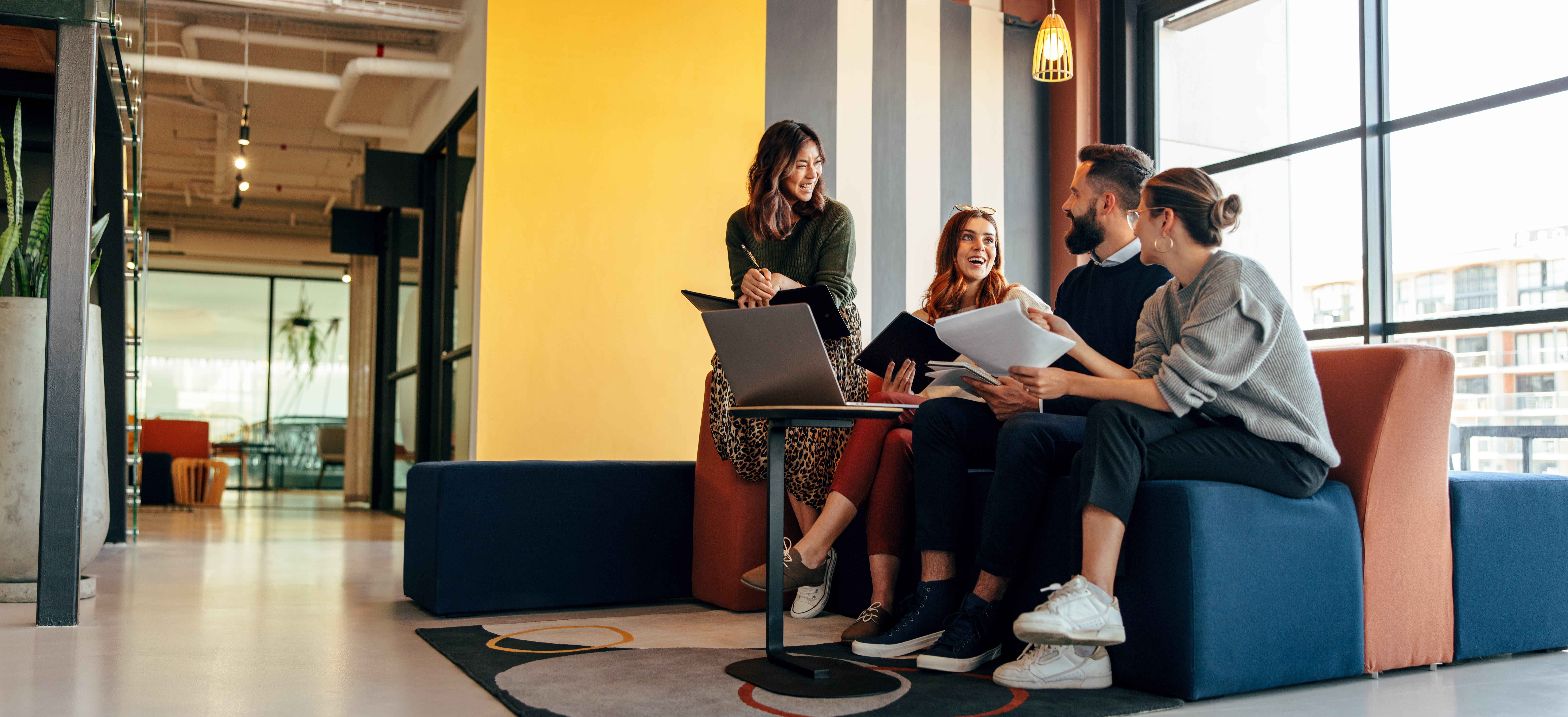 Colleagues chatting in a modern office space