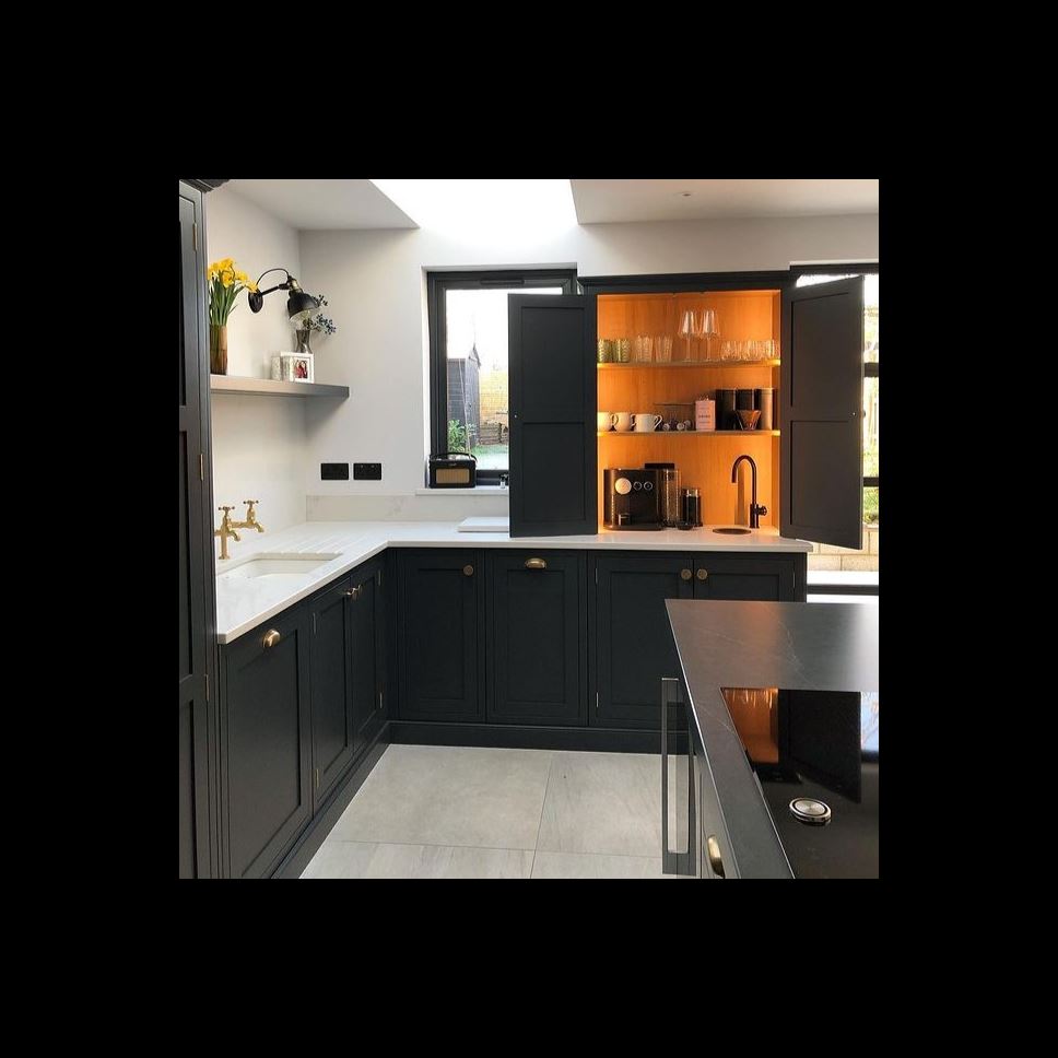 Image credit: @renovating_number_51 black kitchen hidden bar