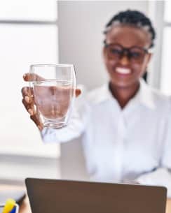 woman with glass of filtered water